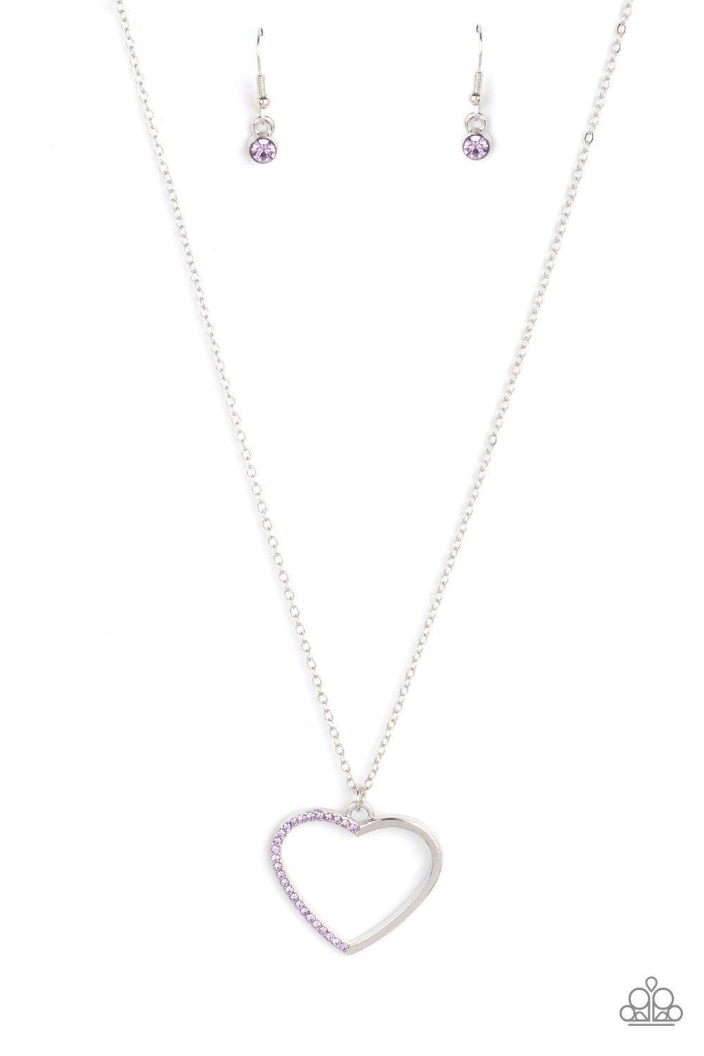 One side of a shiny silver heart frame has been adorned in dainty purple rhinestones, resulting in a flirtatious pendant at the bottom of a dainty silver chain. Features an adjustable clasp closure.