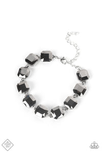 A sultry strand of faceted hematite gems unapologetically smolders as it connects around the wrist in an enticing fashion. Features an adjustable clasp closure.  Sold as one individual bracelet.  New Kit Fashion Fix
