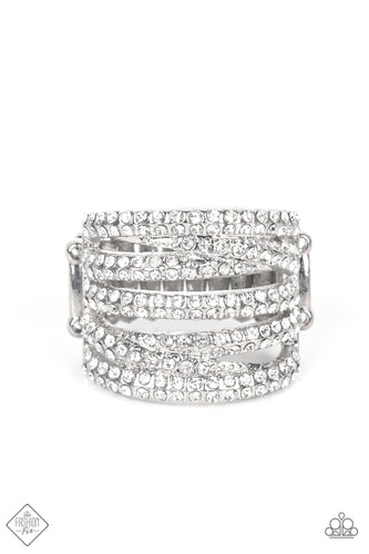 Encrusted in dainty pairs of blinding white rhinestones, row after row of glitzy silver bands stack and crisscross across the finger for a knockout look. Features a stretchy band for a flexible fit.  Sold as one individual ring.  New Kit Fashion Fix