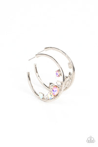 Featuring various cuts and shimmer, mismatched white, iridescent and UV peach rhinestones delicately collect along the bottom of a classic silver hoop for a glitzy accent. Earring attaches to a standard post fitting. Hoop measures approximately 1 3/4" in diameter. 