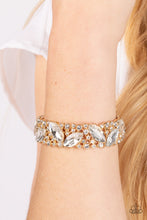 Load image into Gallery viewer, Oversized marquise cut white rhinestones sparkle atop icy frames of dainty gold studs and white rhinestones that are threaded along stretchy bands around the wrist for a jaw-dropping dazzle.
