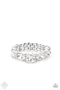 A gorgeous white rhinestone solitaire is bordered by marquise cut rhinestones tipped onto their sides followed by dainty rhinestones that add an endearing touch to the sentimental band. Features a dainty stretchy band for a flexible fit.  Sold as one individual ring.  New Kit Fashion Fix