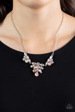 Load image into Gallery viewer, Varying in cut and shimmer, bubbly clusters of mismatched white and iridescent peach and coral rhinestones coalesce into three sparkly frames for an out-of-this-world statement below the collar. Due to its prismatic palette, color may vary. Features an adjustable clasp closure. 
