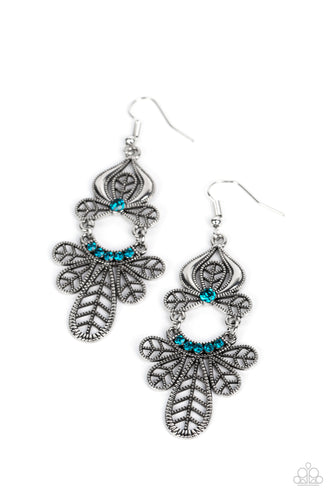 Studded leafy frames flare out from the bottom of a curved row of glittery blue rhinestones that swings from the bottom of a matching leafy silver frame. A solitaire blue rhinestone dots the uppermost frame, adding a collective shimmer to the seasonal chandelier. Earring attaches to a standard fishhook fitting.