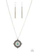 Load image into Gallery viewer, An iridescent green rhinestone is pressed into the studded center of a compass inspired frame, creating a stellar pendant at the bottom of an extended silver chain. Due to its prismatic palette, color may vary. Features an adjustable clasp closure. 
