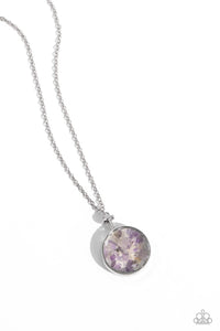 Pieces of amethyst stones shift back and forth inside a glassy frame encased in a silver compass-like fitting, resulting in a dramatically earthy pendant at the bottom of an extended silver chain. Features an adjustable clasp closure.