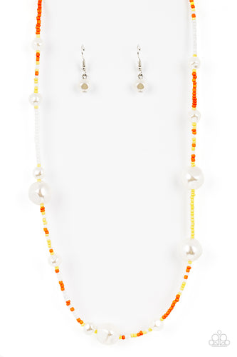 Irregular shaped pearls in varying sizes are scattered amongst orange, yellow, and white seed beads that are threaded along a wire, resulting in a refreshing and playful style below the collar. Features an adjustable clasp closure. 