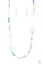 Load image into Gallery viewer, Irregular-shaped pearls in varying sizes are scattered amongst blue, yellow, and white seed beads that are threaded along a wire, resulting in a refreshing and playful style below the collar. 
