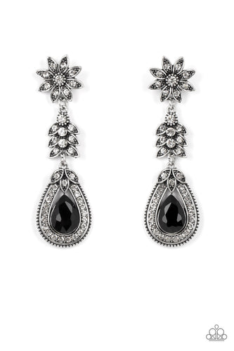 Dotted in dainty white rhinestones, a studded silver flower gives way to a leafy frame that is delicately suspended above a decorative white rhinestone dotted teardrop frame. An oversized black teardrop gem seemingly floats inside the center of the lowermost frame, adding timeless dazzle to the floral fairytale. Earring attaches to a standard post fitting.