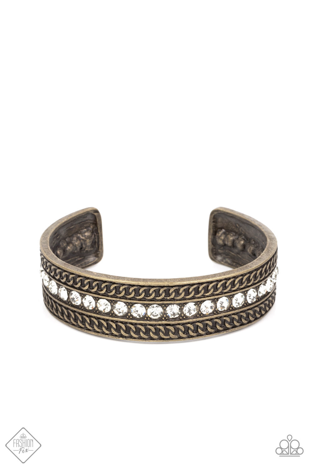 A row of sparkling white rhinestones, surrounded by studded texture, is bordered by an intricate chain-like motif etched in antiqued brass. The contrast of sparkle and grit results in an unapologetically industrial cuff that wraps boldly around the wrist.  Sold as one individual bracelet.  New Kit Fashion Fix