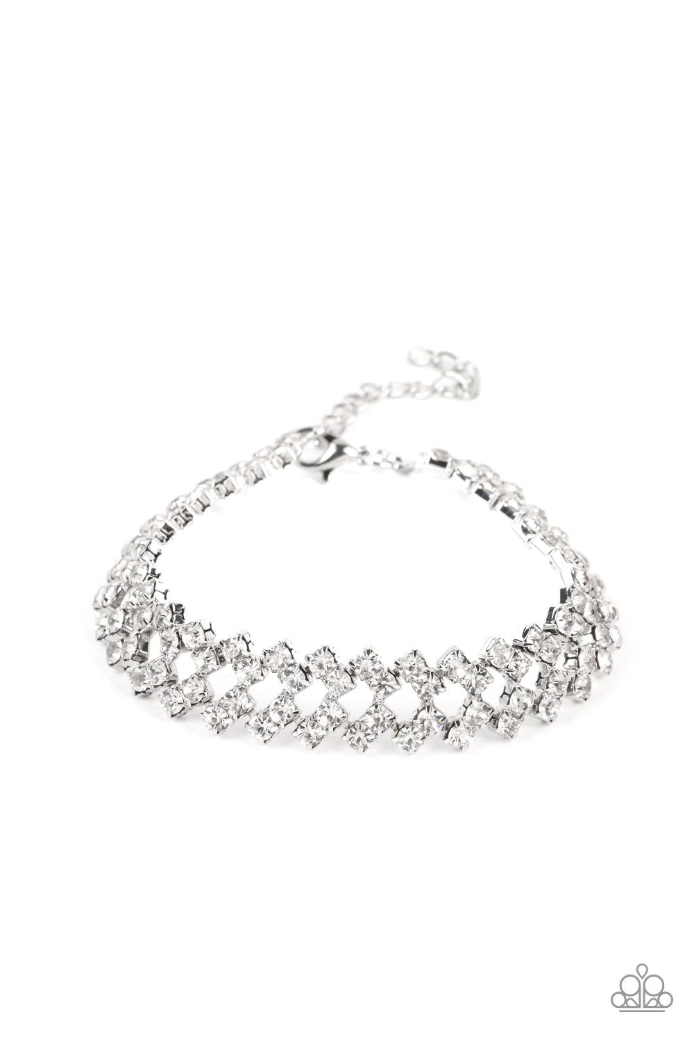 Set in pronged silver settings, pairs of icy white rhinestones haphazardly stack around the wrist in sizzling rows of shimmer. Features an adjustable clasp closure.  Sold as one individual bracelet.