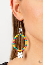 Load image into Gallery viewer, Featuring the summery hues of Empire Yellow, Beetroot Purple, and Harbor Blue, dainty seed beads are threaded along a wire hoop that swings between two hammered silver discs for a tropical inspired fashion. Earring attaches to a standard fishhook fitting.
