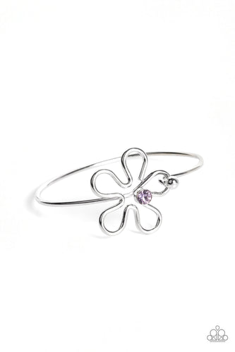 Dotted with a sparkly purple rhinestone center, shiny silver bars curve into a floral frame atop a dainty silver bangle around the wrist. Features a pronged closure. 