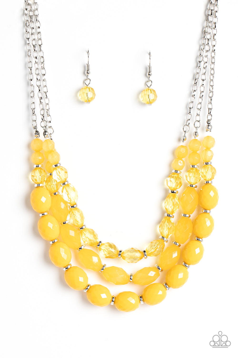 Separated by dainty silver rings, mismatched rows of glassy, opaque, and solid Daffodil acrylic crystal-like beads are threaded along invisible wires below the collar, creating vivacious layers. Features an adjustable clasp closure. Featured inside The Preview at GLOW!