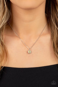 Bordered in glassy white rhinestones, a dainty yellow rhinestone heart sparkles along a dainty silver chain below the collar for a flirtatious fashion. Features an adjustable clasp closure.