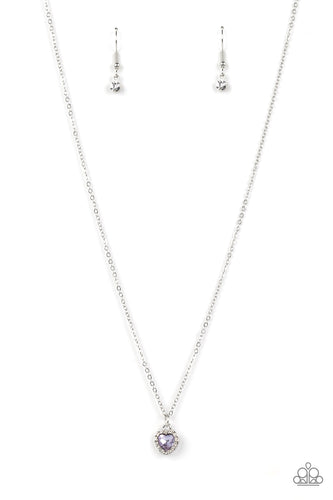 Bordered in glassy white rhinestones, a dainty purple rhinestone heart sparkles along a dainty silver chain below the collar for a flirtatious fashion. Features an adjustable clasp closure.