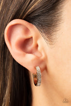 Load image into Gallery viewer, Sparkling white rhinestones line the front of a petite gold hoop, creating edge-to-edge shimmer.  Earring attaches to a standard post fitting. Hoop measures approximately 3/4&quot; in diameter. 
