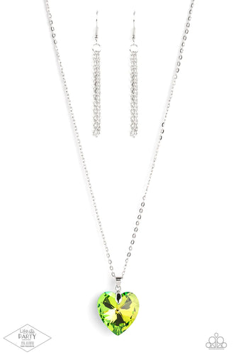 Chiseled into a charming heart, an oversized multicolored gem slides along a dainty silver chain below the collar for a flirtatious finish. Features an adjustable clasp closure. Due to its prismatic palette, color may vary.  Sold as one individual necklace. Includes one pair of matching earrings.