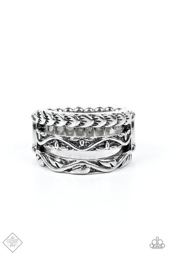 Three silver bands, embellished with floral motifs, stack into an airy display atop the finger. Features a stretchy band for a flexible fit.  Sold as one individual ring.  New Kit Fashion Fix