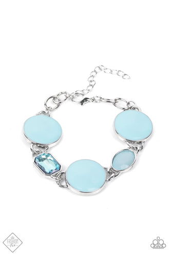 A rectangular sparkling blue gem and a milky blue oval bead add elegance to a monochromatic collection of three oversized pastel blue circles. Set in silver frames, the whimsical collection attaches to a silver chain, for a refreshing splash of color around the wrist. Features an adjustable clasp closure.  Sold as one individual bracelet.  New Kit Fashion Fix
