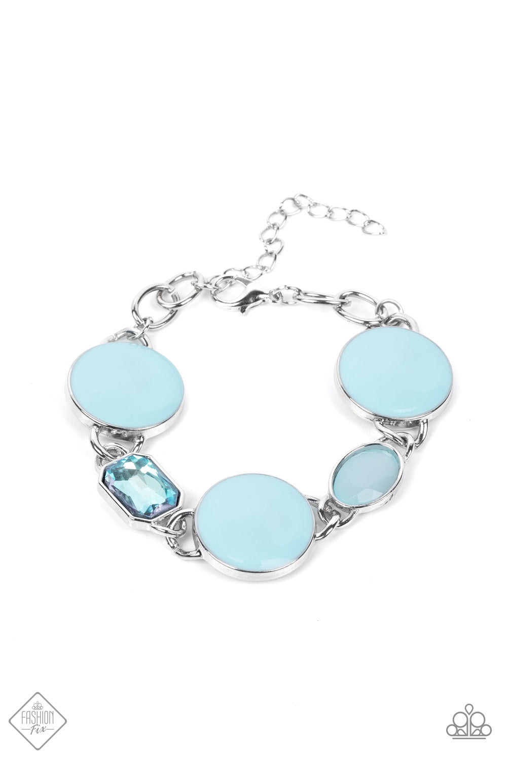 A rectangular sparkling blue gem and a milky blue oval bead add elegance to a monochromatic collection of three oversized pastel blue circles. Set in silver frames, the whimsical collection attaches to a silver chain, for a refreshing splash of color around the wrist. Features an adjustable clasp closure.  Sold as one individual bracelet.  New Kit Fashion Fix