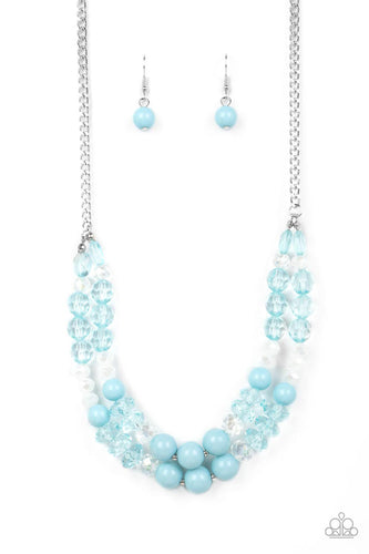 Featuring white, iridescent, and Spun Sugar, mismatched sections of glassy, crystal-like, and acrylic beads are threaded along invisible wires below the collar. Suspended from the bottom of a shiny silver chain, the colorful layers twinkle and shimmer in the light. Features an adjustable clasp closure.