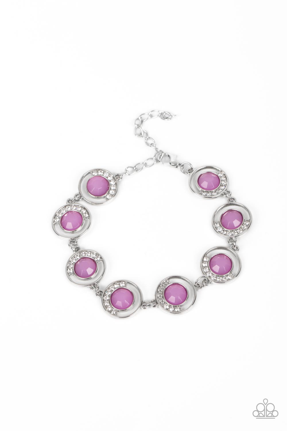 An arc of glassy white rhinestones curls around one side of an opaque purple gem inside a dainty silver hoop. The twinkly frames delicately link around the wrist, creating a mystical centerpiece. Features an adjustable clasp closure. 