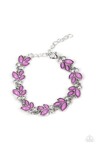 Trios of purple beads fan out from pairs of white rhinestones as they delicately link around the wrist, resulting in colorful leafy accents. Features an adjustable clasp closure.
