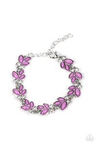 Trios of purple beads fan out from pairs of white rhinestones as they delicately link around the wrist, resulting in colorful leafy accents. Features an adjustable clasp closure.