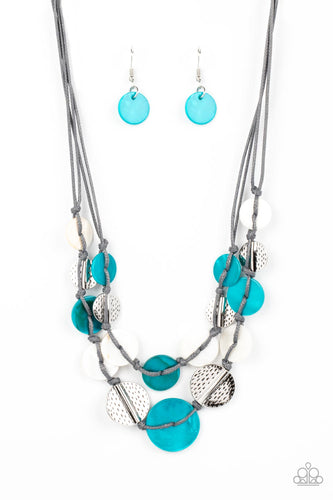 Vibrant blue and white shells interlace with silver dotted, hammered discs to create a refined pop of color. Held together by soft gray cording, this piece will blend in with beaches near you! Features an adjustable clasp closure.