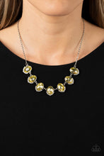 Load image into Gallery viewer, Dainty rows of glittery white rhinestones gently curve around the bottoms of oversized Daffodil oval gems. The sparkly frames delicately connect below the collar, creating a colorful centerpiece. Features an adjustable clasp closure.
