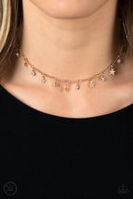 Load image into Gallery viewer, Dainty white rhinestones and flat gold stars twinkle along a classic gold chain around the neck, resulting in a stellar fringe. Features an adjustable clasp closure.
