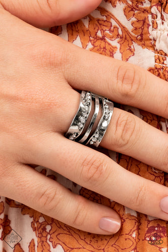Dotted with dainty white rhinestones, warped folds of silver create wavy silver bars across the finger, invoking rustic refinement. Features a stretchy band for a flexible fit.  Sold as one individual ring.  New Kit Fashion Fix