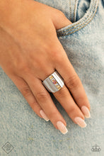 Load image into Gallery viewer, Featuring a high sheen silver, a wide band is divided down the center by a stack of five dainty square gems. The spectrum of colors from white to yellow to coral creates a prismatic arrangement atop the finger. Features a stretchy band for a flexible fit.  Sold as one individual ring.  New Kit Fashion Fix
