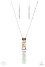 Load image into Gallery viewer, Geometric shapes in various colors and finishes gathers into a trendy art deco-inspired pendant. An array of materials like wood, opal, and glittery gems add a handcrafted vibe to the pendant as it sways from the bottom of a lengthened silver chain, with a stream of sparkling silver chains bringing a flirty finishing touch to the design. Features an adjustable clasp closure.  Sold as one individual necklace. Includes one pair of matching earrings.  New Kit Fashion Fix
