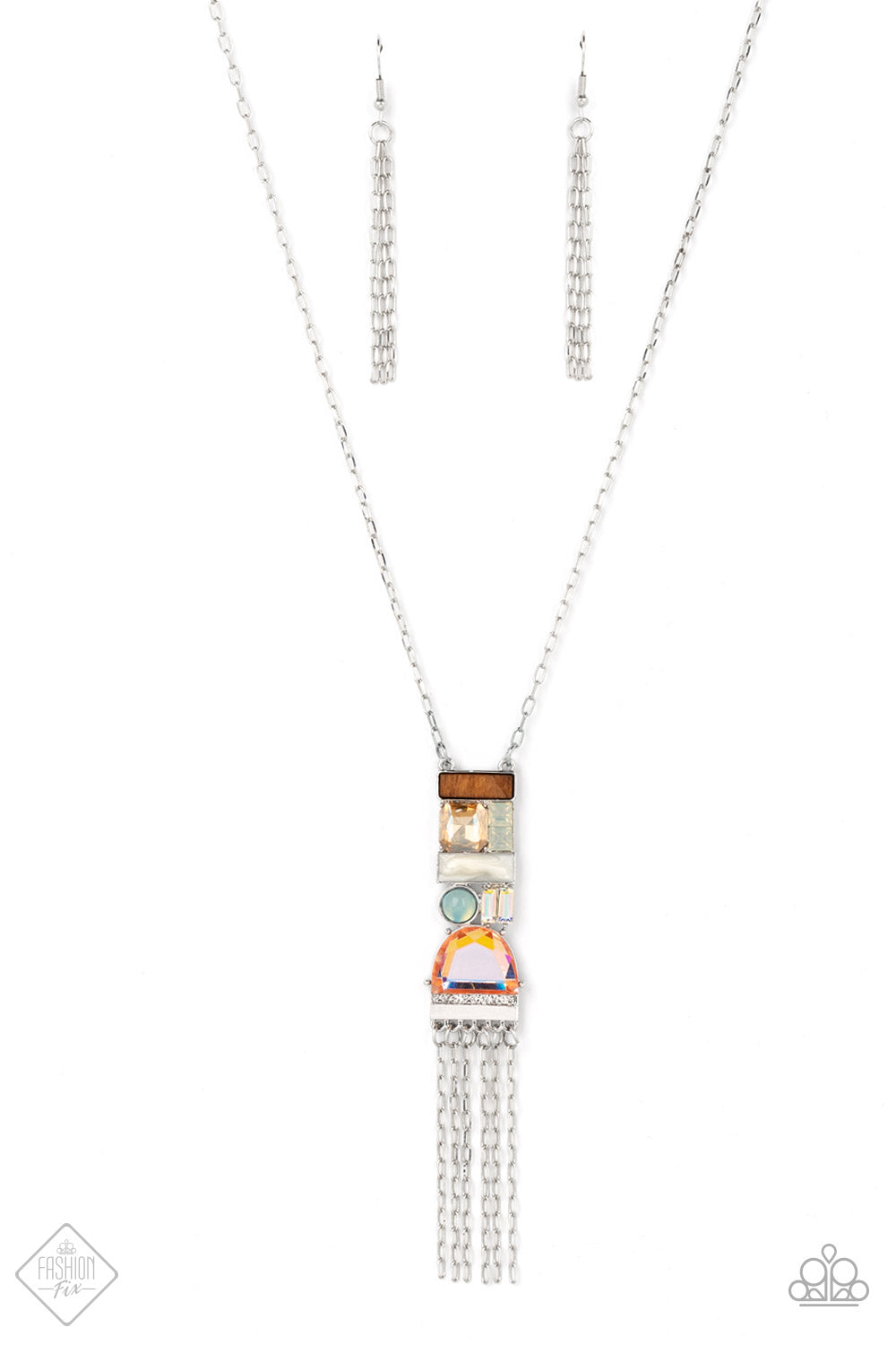 Geometric shapes in various colors and finishes gathers into a trendy art deco-inspired pendant. An array of materials like wood, opal, and glittery gems add a handcrafted vibe to the pendant as it sways from the bottom of a lengthened silver chain, with a stream of sparkling silver chains bringing a flirty finishing touch to the design. Features an adjustable clasp closure.  Sold as one individual necklace. Includes one pair of matching earrings.  New Kit Fashion Fix