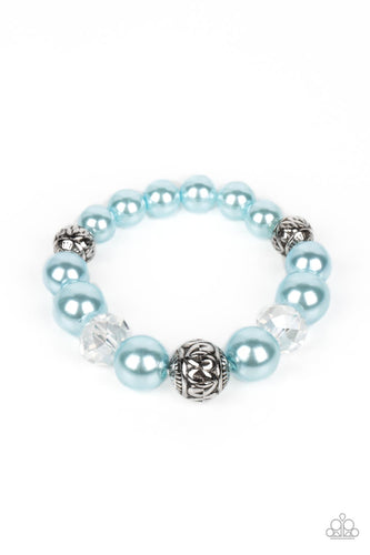 Bubbly Spun Sugar pearls, textured silver accents, and clear faceted beads nobly drape around the wrist on an elastic stretchy band for a refined pop of color. 
