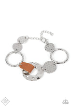 Load image into Gallery viewer, An assortment of silver hoops and discs are hammered in handcrafted texture as they link around the wrist. A strip of brown leather connects two of the pieces, adding a touch of rustic charm to the design. Features an adjustable clasp closure.  Sold as one individual bracelet.  New Kit Fashion Fix
