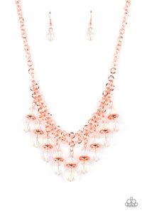 Featuring a stellar iridescence, pairs of glassy beads are separated by shiny copper discs, trickling below the collar in an effervescent fringe. Features an adjustable clasp closure. Due to its prismatic palette, color may vary. 
