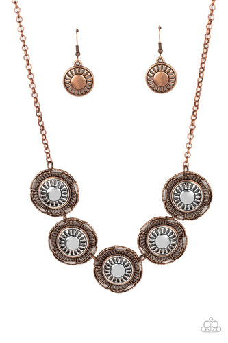 Studded copper bars asymmetrically arc around studded copper petals that bloom from stenciled silver centers. The handcrafted frames delicately link below the collar, creating a rustic statement piece. Features an adjustable clasp closure. </p><br>Featured inside The Preview at GLOW! 