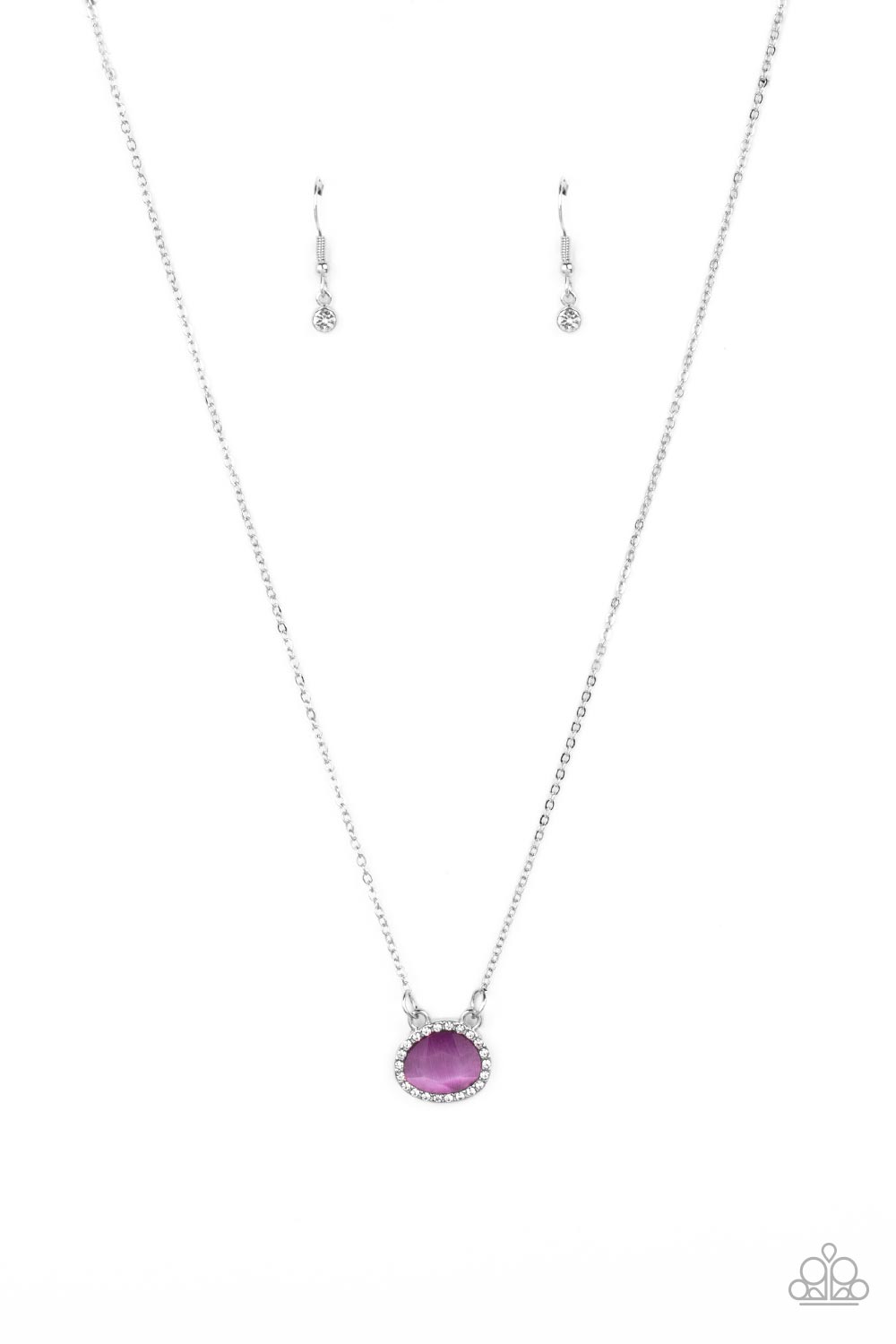 Bordered in a ring of dainty white rhinestones, an imperfect Very Peri gemstone twinkles along a dainty silver chain. Featuring a faceted shimmer, the dainty pendant creates a treasured pendant below the collar. Features an adjustable clasp closure. 