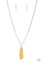 Load image into Gallery viewer, Featuring a faux stone finish, yellow smoke is encapsulated in an acrylic frame below the collar. Glittery crystal-like beads sparkle along the silver chain, drawing attention to the mystical pendant. Features an adjustable clasp closure. Due to is prismatic palette, color may vary. 
