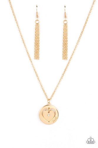 Dotted with a dainty white rhinestone, a gold heart charm swings freely inside of a heart-cutout gold frame. Stamped in the word, 