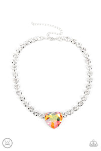 A dramatically oversized heart-shaped gem with a reflective, iridescent orange finish glitters at the center of a blinding row of glassy white rhinestones, resulting in a flirtatious sparkle around the neck. Features an adjustable clasp closure. Due to its prismatic palette, color may vary.