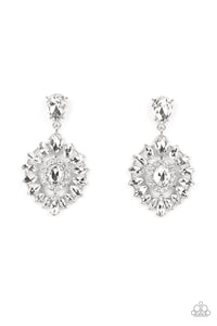 Bordered in dainty white rhinestones, an oval white gem is pressed into the center of an explosion of white marquise cut rhinestones. The icy frame swings from the bottom of a solitaire teardrop rhinestone, adding flirtatious movement to the jaw-dropping display. Earring attaches to a standard post fitting.  Sold as one pair of post earrings.
