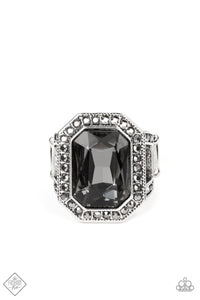An oversized, smoky, emerald-cut gem smolders inside a framework of studded silver texture and glitzy hematite rhinestones, resulting in an awe-inspiring statement piece that glamorously sits atop the finger. Features a stretchy band for a flexible fit.  Sold as one individual ring.  New Kit Fashion Fix