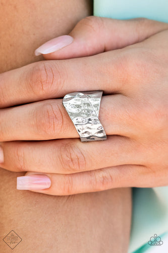 Two wide silver ribbons are hammered in texture as they delicately overlap at the center of the finger to create a rustic metallic statement piece. Features a stretchy band for a flexible fit.  Sold as one individual ring.  New Kit Fashion Fix