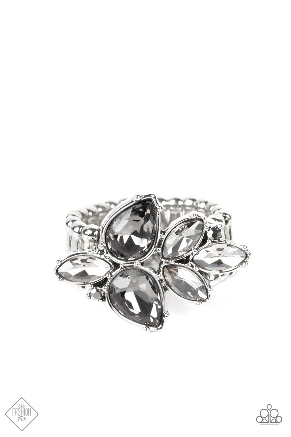 Smoky teardrop gems, accented with glassy marquise cut rhinestones, build into a fragmented cluster creating a glistening centerpiece atop the finger. Features a stretchy band for a flexible fit.  Sold as one individual ring.  New Kit Fashion Fix