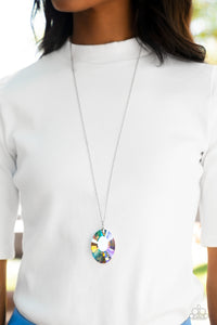 Featuring a reflective focal point and an exaggerated faceted surface, a dramatically oversized, iridescent gem sparkles at the bottom of a lengthened silver chain for an out-of-this-world kind of dazzle. Features an adjustable clasp closure. Due to its prismatic palette, color may vary. 