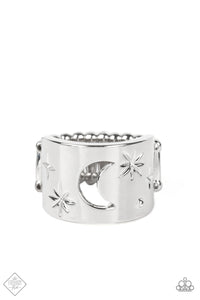 A thick band of silver is stamped in abstract stars that surround a crescent moon cutout at its center. A single raised dot adds eye-catching detail as the cosmic display curves boldly around the finger. Features a stretchy band for a flexible fit.  Sold as one individual ring.  New Kit Fashion Fix